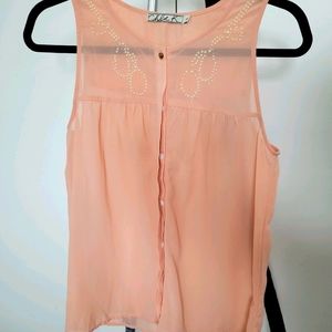 Peach colored blouse